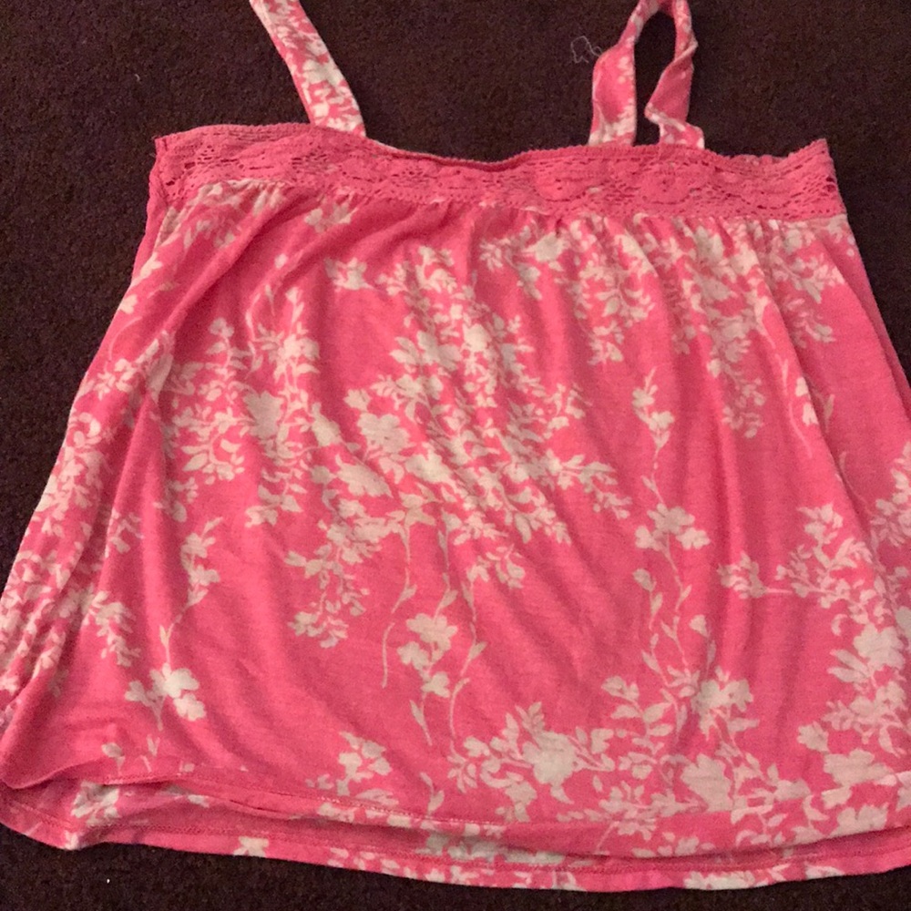 A pink tank top with white flowers